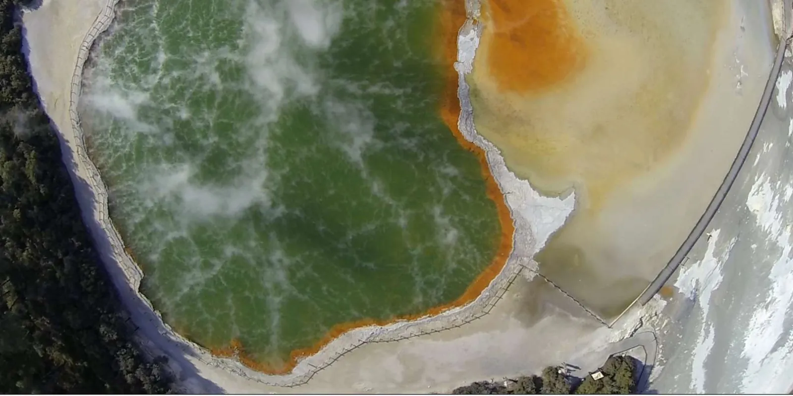 Straight-down aerial of the Champagne Pool beside the yellow Artist's Palette flat