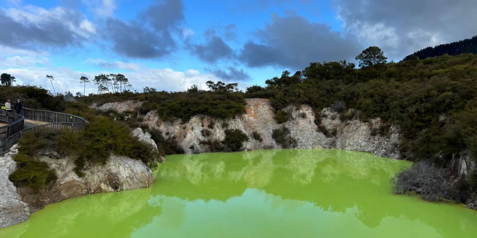 Devil's Bath at Wai-O-Tapu, its bright green water seen from the boardwalk above